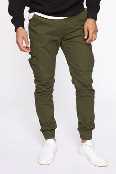 Available In Black, Khaki, Olive, And Camouflage Button Closure Zip Fly Cargo Pants Elastic Hem 31 Inseam 98% Cotton 2% Spandex Imported | Mens Kryptonite Cargo Pants in Olive Green size 32 by Fashion Nova Celana Kargo, Olive Green Cargo Pants, Celana Fashion, Olive Fashion, Cargo Pants Outfit, Green Cargo Pants, Streetwear Shop, Green Cargo, Mens Pants Fashion