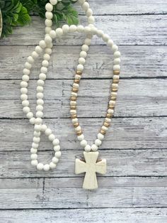 This necklace is one of my shop's best sellers! They easily slip over your head with no clasp and are made with gorgeous natural howlite stones, lightweight white wood beads, and howlite stone statement crosses. They measure approximately 32-33 inches with the cross pendant hanging 2 inches.  These are all hand made and will have slight variations from the photos due to the nature of natural beads, including the cross pendant (see photos). In the listing, you can choose gold or silver accents. White Spiritual Jewelry With Wooden Beads, Spiritual White Jewelry With Wooden Beads, Adjustable Wooden Beads Jewelry For Blessing, Adjustable White Cross Necklace, Adjustable White Cross Necklaces, White Wooden Beads Jewelry For Meditation, White Wooden Beaded Jewelry For Meditation, White Beaded Cross Necklace, White Wooden Beads Necklace For Meditation