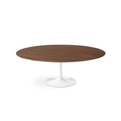 an oval wooden table with white base