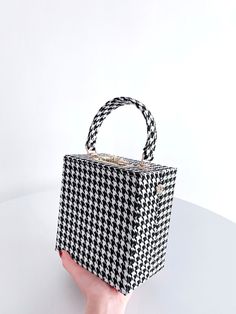 BagForLove-Houndstooth Pattern Top Handle Box Bag - Women Evening & Clutch Product Description Color Black and White Strap Type Adjustable Style Elegant Pattern Type Houndstooth Bag Size Small Quantity 1 piece Magnetic No Type Box Bag Composition 100% Polyurethane Material PU Leather Size Chart INCH CM Size Bag Width Bag Height Bag Length Strap Length one-size 3.9 6.5 6 31.5 Size Bag Width Bag Height Bag Length Strap Length one-size 10 16.5 15.3 80 Similar Products h2 { text-align: center; } .re Black Rectangular Bag With Houndstooth Pattern, Chic Rectangular Houndstooth Shoulder Bag, Chic Houndstooth Rectangular Shoulder Bag, Chic Black Bag With Houndstooth Pattern, Chic Black Houndstooth Pattern Bag, Houndstooth Bag, Elegant Pattern, Houndstooth Pattern, Box Bag