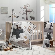 a baby's room with teddy bears and cribs