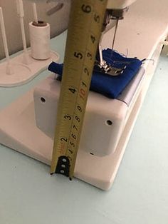 a sewing machine with a measuring tape on it