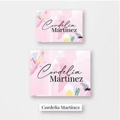 two business cards with flowers on them, one is pink and the other is white