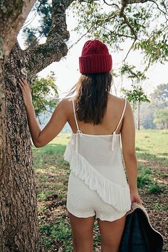 So easy and ethereal, this stunning tunic from our free-est collection has endless ways to wear. **Fit:** Relaxed, asymmetrical longline fit **Features:** Square neckline, draped seaming at the front, asymmetrical ruffle hemline, semi-sheer design **Why We ❤ It:** Bold with bloomers or easy with jeans, this style deserves a spot in every wardrobe. | Phoebe Tunic by free-est at Free People in White, Size: M Square Necklines, Small Bust, Long A Line, Square Neckline, Workout Tops, Boho Outfits, Knitwear, Free People, Relaxed Fit