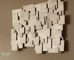 a piece of art made out of wood blocks on a wall with the words bon temp's