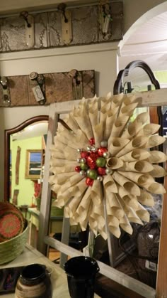 a large paper flower is on display in a room with other items and decorations around it