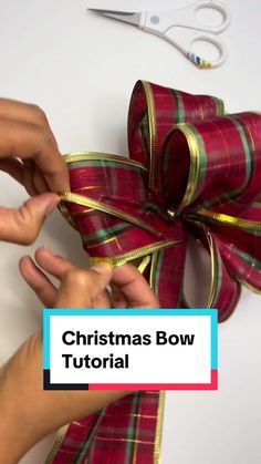 someone is wrapping a christmas bow with ribbon