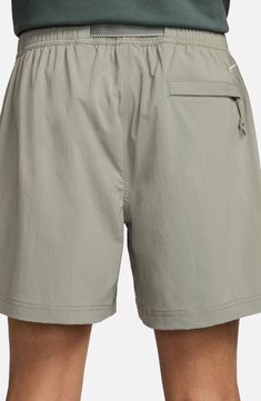 Lightweight, stretchy and ready for adventure, these water-repellent nylon shorts wick away sweat and give you secure pockets for stowing a day's essentials. 6 1/4" inseam; 27" leg opening; 13" front rise; 15" back rise (size Medium) Zip fly with button closure Partial elastic waist Removable belt Front zip pockets; back zip-welt pocket Moisture-wicking fabric engineered for dryness and comfort Water-repellent 96% nylon, 4% spandex Machine wash, tumble dry Imported Nordstrom x Nike: A curated li Functional Nylon Athletic Shorts With Pockets, Outdoor Athletic Stretch Shorts In Solid Color, Outdoor Athletic Shorts With Stretch, Solid Color, Solid Moisture-wicking Athletic Shorts For Outdoor Activities, Outdoor Solid Stretch Athletic Shorts, Outdoor Solid Color Stretch Athletic Shorts, Outdoor Athletic Stretch Shorts, Bottoms With Built-in Shorts For Outdoor Activities, Nike Moisture-wicking Nylon Athletic Shorts