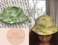 a woman wearing a green crocheted hat next to a knitted wall hanging