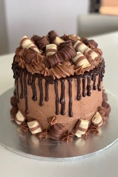 a cake with chocolate icing and marshmallows on top