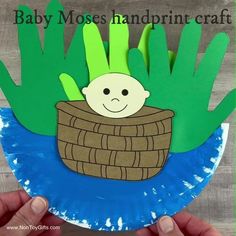 handprinted paper plate with an image of a baby in a basket