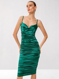 Linger in the luxury of this emerald ruched midi dress, designed to make a bold statement with its rich hue and sumptuous texture. The delicate spaghetti straps frame a sleek silhouette, leading to a gently ruched bodice that flatters and enhances your natural curves. The skirt, ruched to perfection, creates a silhouette that is both alluring and sophisticated, making it ideal for upscale events or romantic evenings out. This dress is an epitome of elegance, offering a modern twist on classic velvet grandeur. Size US Bust Hip Size Length Waist Size S 4 30.7 31.5 38.4 25.6 M 6 32.3 33.1 40 27.2 L 8/10 33.9 34.6 40.6 28.7 Green Ruched Bodice Midi Dress For Evening, Green Midi Dress With Ruched Bodice For Evening, Elegant Green Midi Dress With Ruched Bodice, Green Sweetheart Neckline Midi Dress For Cocktail, Elegant Ruched Midi Dress With Spaghetti Straps, Green Dress With Spaghetti Straps And Ruched Back, Green Ruched Dress With Spaghetti Straps, Green Ruched Spaghetti Strap Dress, Ruched Midi Dress With Spaghetti Straps For Dinner