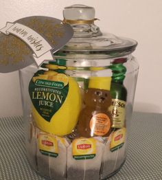 a glass jar filled with lemon juice and other items