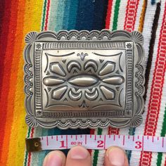 "This piece is a classic rectangular belt buckle with scalloped edges and lovely sterling silverwork. Great gift for an anniversary, birthday or an amazing wedding suit addition for a southwestern vibe. 49 grams for the entire piece 2.4\" long 3\" wide 2\" wide attachment for belt Signed by artist BLKGT and sterling silver hallmark. If you have questions about this item etc please ask before you purchase. Sold as-is, no returns or exchanges on any jewelry. Free domestic shipping Thanks for looki Luxury Belt Buckle With Silver Buckle For Gift, Luxury Vintage Silver Belt Buckles, Classic Silver Belt Buckles With Polished Finish, Artisan Engraved Belt Buckles As Gift, Artisan Engraved Belt Buckles For Gifts, Rectangular Engraved Silver Belt Buckles, Rectangular Silver Engraved Belt Buckles, Classic Silver Buckle Belt Buckles As Gift, Silver Rectangular Engraved Belt Buckles