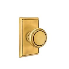 an image of a golden door knob on a white background