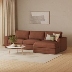 a living room with a couch, coffee table and rug in front of a window