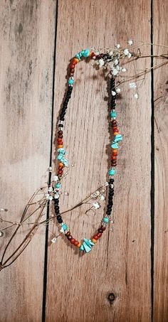 Wild and Free is a cute necklace with black, brown, red, orange, and turquoise beads. Colorful and cute for many occasions! Southwestern Black Beaded Necklaces For Festivals, Southwestern Black Beaded Necklace For Festivals, Black Necklaces With Colorful Beads For Beach, Brown Necklaces With Black Beads For Beach, Southwestern Style Multicolor Necklaces With Dangling Beads, Southwestern Black Necklace With Colorful Beads, Multicolor Beaded Chain Bohemian Turquoise Necklace, Multicolor Bohemian Beaded Chain Turquoise Necklace, Bohemian Multicolor Turquoise Necklace With Beaded Chain