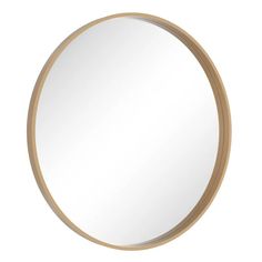 a round mirror on a white wall