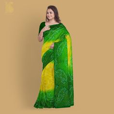 Experience the exquisite charm of Khinkhwab's Bandhani Banarasi saree. This beautiful piece effortlessly combines rich sophistication with comfort, making it an ideal all-weather attire. Elevate your style with this timeless creation. Elegant Pre-draped Saree With Bandhani Print, Elegant Chanderi Saree With Bandhani Print, Elegant Pre-draped Saree In Bandhani Print Art Silk, Elegant Art Silk Saree With Bandhani Print, Elegant Bandhani Print Saree, Elegant Bandhani Print Saree For Transitional Season, Elegant Semi-stitched Bandhani Print Saree, Elegant Semi-stitched Bandhani Saree, Traditional Yellow Bandhani Print Saree