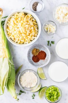 ingredients for corn on the cob laid out in bowls