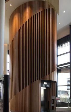 a large wooden wall in an office building