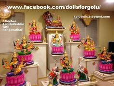 there are many small statues on the shelves in front of each other, all decorated with different colors and designs