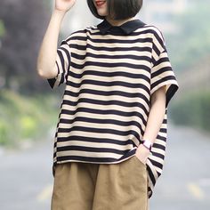 Details Pattern Type: StripeSleeve Type: Short SleeveSilhouette: ShiftMaterial: PolyesterNeckline: Polo CollarOccasion: Daytime, DailyProcess: StitchTheme: SummerColor: Black & White, Black & BeigeSize: M, L Size Chart M Shoulder: 53 cm/ 20.87 ''Bust: 120 cm/ 47.24 ''Length: 62-69 cm/ 24.41-27.16 ''Cuff: 42 cm/ 16.54 ''Sleeve: 14 cm/ 5.51 ''LShoulder: 54 cm/ 21.26 ''Bust: 124 cm/ 48.82 ''Length: 63-70 cm/ 24.80-27.56 ''Cuff: 43 cm/ 16.93 ''Sleeve: 15 cm/ 5.91 '' Casual Striped Short Sleeve Blouse, Oversized Striped Short Sleeve Blouse, Black Short Sleeve Top For Summer Workwear, Short T Shirt, Polo Collar, White Black, Size Chart, Black And White, Collar