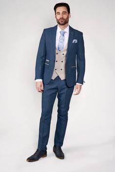 Wedding suit tick! The Dion suit is made for grooms with its soft lapis blue tone and champagne trims. It has been created with meticulous craftsmanship using a herringbone weave and the added wool content lends a hand to durability and comfort. The neutral beige tone of the Kelvin Waistcoat lends itself perfectly for a mix-and-match look that will differentiate the groom from the groomsmen. Waistcoat also available in a single-breasted option. Model wears size 40R blazer, 40R waistcoat & 34R tr Blue Shirt White Collar, Unique Mens Wedding Suits, Wedding Suits For Bride, Casual Groomsmen, Sky Blue Suit, Blue Three Piece Suit, Navy Suit Wedding, Bow Tie Suit, Tweed Wedding Suits