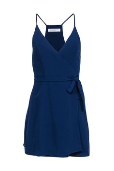 Get ready to make a statement in this Amanda Uprichard navy sleeveless wrap mini dress! Perfect for a date night or night of dancing, this dress exudes charm and style. Pair it with a strappy open-toe heel and silver jewelry for a complete head-turning look. Size S 100% Polyester Unlined Wrap tie closure Sleeveless Bust 30" Waist 23" Shoulder to hem 34.5" Elegant Sleeveless Mini Dress With Wrap-around Straps, Sleeveless Mini Dress With Wrap-around Straps For Date Night, Dressy Wrap Dress With Surplice Neckline For Date Night, Party Mini Dress With Wrap-around Straps, Wrap-around Strap Mini Dress For Date Night, Summer Wrap-around Straps Mini Dress For Date Night, Summer Mini Dress With Wrap-around Straps For Date Night, Mini Length Dress With Wrap-around Straps For Date Night, Date Night Mini Dress With Wrap-around Straps