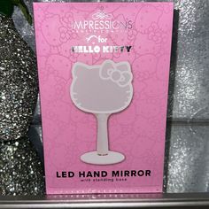 the hello kitty led hand mirror is on display