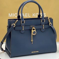 Michael Kors Hamilton Medium Satchel Navy Color Michael Kors Logo At Front Snap Top Closure Gold Toned Hardware Navy Color Mk Key & Lock On Front 4 Protective Feet Custom Mk Fabric Lining 1 Slip-In Pockets 1 Zipper Pocket 13" (L) X 9"(H) X 5"(D) Strap: 4", 18"- 24" Very Clean, Smoke-Free And Pet-Free Environment. Shopping Orlando, Michael Kors Handbags Black, Navy Handbag, Navy Purse, Nice Gifts, Michael Kors Satchel, Michael Kors Logo, Black Satchel, Bags Michael Kors