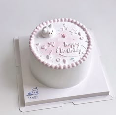 a birthday cake on top of a white box