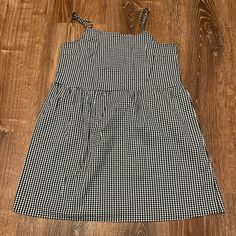 Color: Gingham (Black, White) Size: S Condition: Never Worn Casual Black Cotton Plaid Dress, Casual Black Plaid Cotton Dress, Black Plaid Cotton Mini Dress, Black Cotton Plaid Mini Dress, Spring Picnic Dresses From Urban Outfitters, Spring Picnic Dresses By Urban Outfitters, Urban Outfitters Spring Picnic Dresses, Black Plaid Mini Dress For Picnic, Urban Outfitters Dresses For Spring Picnic