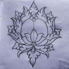 a drawing of a flower on paper with lines in the middle and an intricate design at the bottom