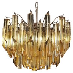 Fantastic vintage Murano chandelier made by 107 Murano crystal clear amber prism triedri in a nickel metal frame. Period: 1980'S Dimensions: 41,90 inches height (108 cm) with chain; 17,70 inches height (45 cm) without chain; 17,70 inches diameter (45 cm) Dimension glasses: 5,90 inches (15 cm) height x 1,18 inches (3 cm) Light bulbs: 6 light bulbs, E14 dimension (not included in the sale) -On request we can replace the lampholders with those suitable for the American electrical system. Condition: Murano Chandelier, Italian Chandelier, Nickel Metal, Antique Chandelier, Murano Glass Chandelier, Crystal Prisms, Chrome Frame, Chandelier For Sale, Prisms