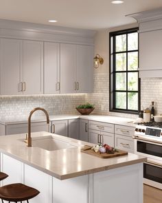 a kitchen with white cabinets and an island