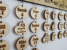 wooden calendars hanging on the wall with names and date for each month in different languages