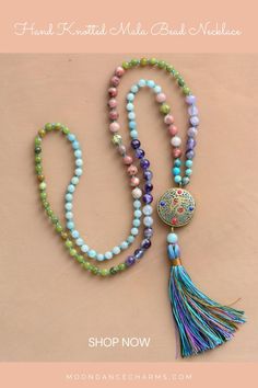 Hand Knotted Mala Bead Necklace. Express yourself more with this colorful Mala Necklace that will support your intentions and will gently remind you of them throughout your day. Check out our mala necklace collection and Get inspired by the meaning of the mala beads. Malas and meditation go hand in hand. They help you to enhance your spiritual practices. We offer a great variety of prayer beads, meditation tools, Japa mala 108 beads, and 27. Check our website to see more> Holistic Mala With 108 Beads For Festival, Holistic Mala With 8mm Beads For Festivals, Beaded Amulet Mala For Meditation, Beaded Mala Amulet For Meditation, Adjustable Multicolor Crystal Necklace With 8mm Beads, Spiritual Mala With 108 Beads For Festival, Spiritual Beaded Necklaces For Meditation And Festivals, Bohemian Crystal Necklaces With 8mm Beads, Multicolor Spiritual Long Beaded Necklaces