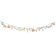 a garland with flowers and ribbons hanging from it's sides on a white background