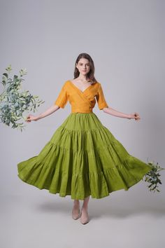 "Linen Maxi Skirt ELLA, Flattering Summer Skirt, Linen Long Skirt, Green Linen Skirt, Handmade Linen Clothing To Rush your order, add lining (recommend for White/Aqua/Light Turquoise/Light Caramel dress), please upgrade your order here: https://www.etsy.com/uk/listing/1334897850/upgrade-order --------------------- About: * The skirt is made from 100% pure linen * Hidden zip at the back * Length: 93cm * Model in the picture is 174cm in height and wearing size S/M, color: Madarine Green ---------- Green Voluminous Tiered Maxi Skirt, Green Voluminous Gathered Skirt, Voluminous Gathered Green Skirt, Green Voluminous Long Skirt, Green Pleated Tiered Mini Skirt, Green Tiered Gathered Skirt, Green Gathered Tiered Skirt, Green Voluminous Skirt For Summer, Green Voluminous Full Skirt