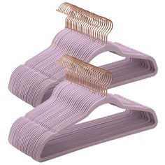 two pink hair combs sitting on top of each other