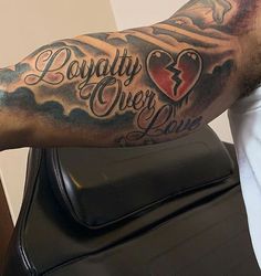 a man with a tattoo on his arm that says, loyalty never dies dien