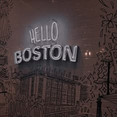 the neon sign for boston is lit up in front of a brick wall with drawings on it