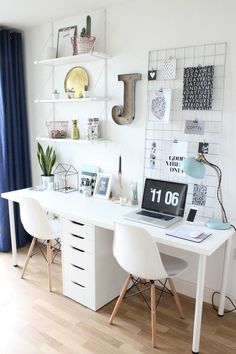 a white desk topped with a laptop computer