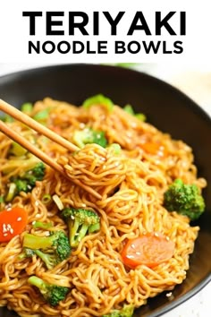 there is noodle and broccoli on the plate with chopsticks in it