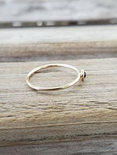 Our stackable 14k Gold Filled ring is amazingly beautiful. It's perfect for stacking or as a simple band. Made with a 4mm Swarovski crystal and gold filled bezel, the ring is roughly 1mm wide and available in the size of your choice. Looking for a different crystal? Let us know. We can customize your order. SIZING: Did you know that ring size changes as your weight changes? Did you lose weight? You may need a smaller size. Have you gained weight? You may need a larger size. It's highly recommend 14k Gold Midi Rings With Bezel Setting, 14k Gold Bezelled Midi Rings, Adjustable Stackable Sapphire Ring Fine Jewelry, Dainty Stackable Sapphire Ring With Round Band, Adjustable Stackable Sapphire Ring In Fine Jewelry Style, Adjustable Stackable Sapphire Fine Jewelry Ring, Gold Stackable Sapphire Ring, Stackable 14k Gold Sapphire Ring, Gold Sapphire Stackable Adjustable Ring