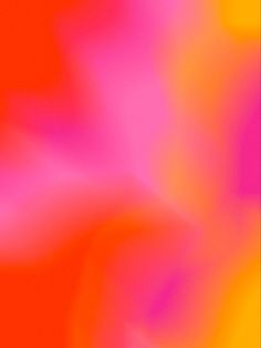 blurry image of an orange and pink flower