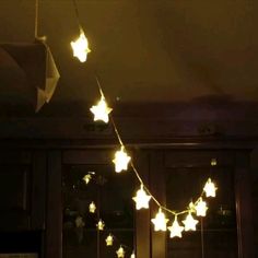 a string of star lights hanging from the ceiling