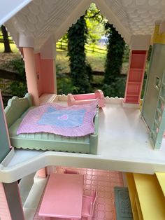 a doll house with furniture and accessories inside