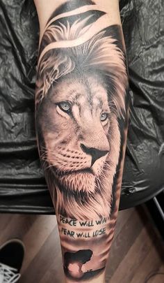 a man's arm with a lion tattoo on it and the words, i will wait